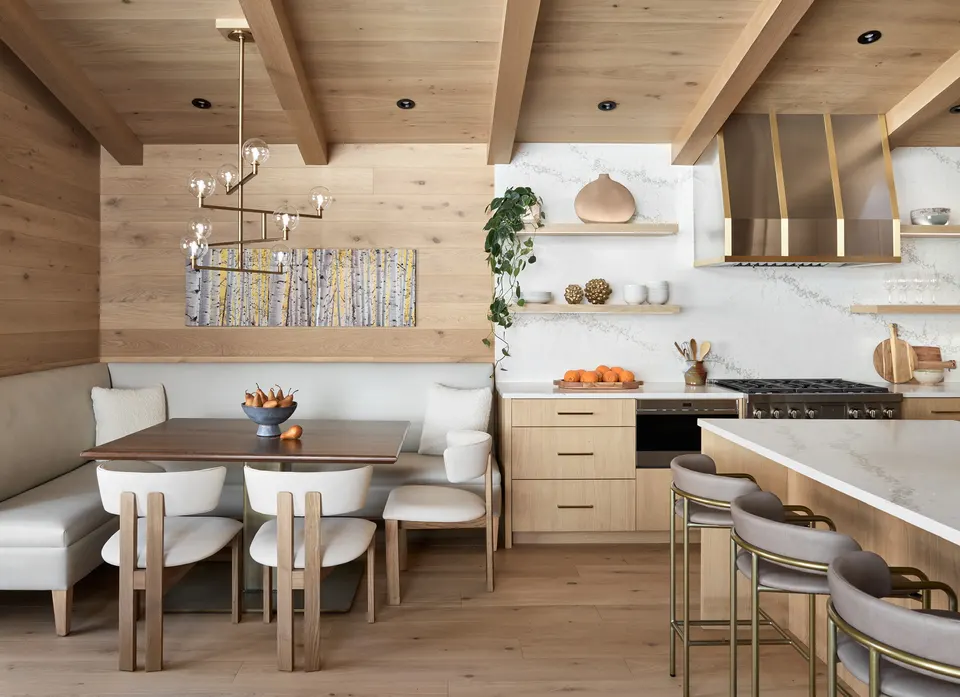 Pale European white oak plank floor in a kitchen with a built-in banquette and white oak ceiling cladding