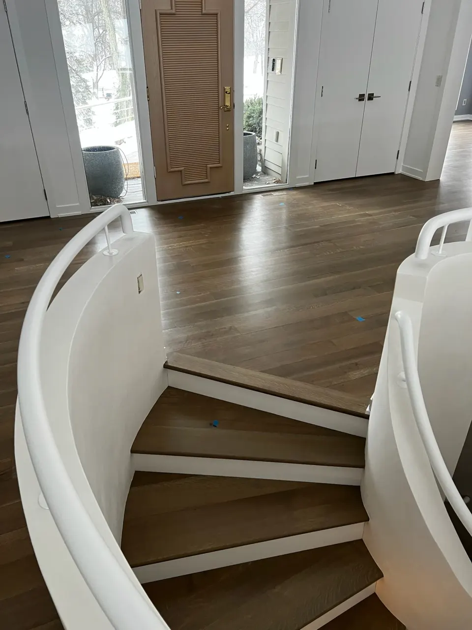 Hardwood treads on a curved entry staircase