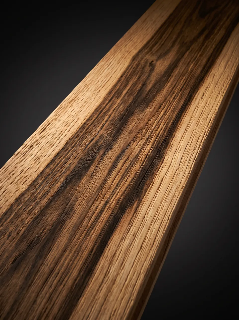 Close view of a hickory plank with pale sapwood and brown heartwood in the same board
